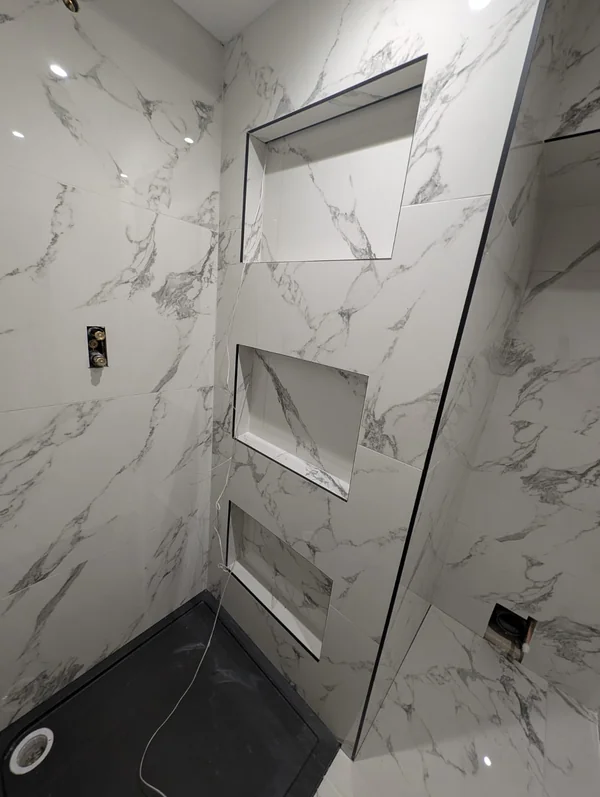 Twin recessed niches — Cut from the same slab, veining carried through
