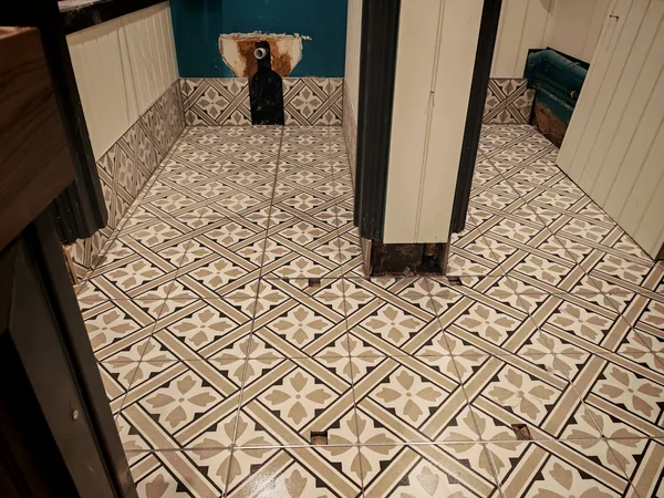 Encaustic hallway — Patterned floor tile, laid square